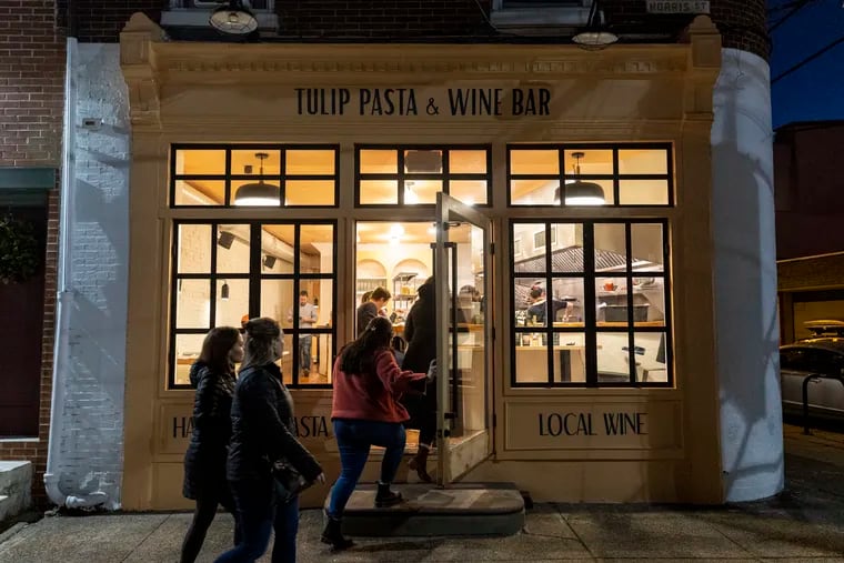 People entering Tulip Pasta & Wine Bar in Philadelphia, Pa., on Wednesday Dec. 28, 2022.