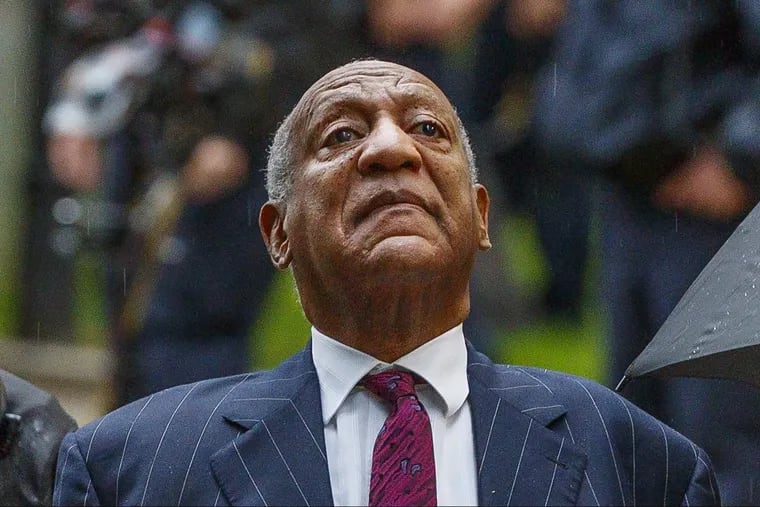 Bill Cosby raises his head toward the sky after a supporter told him to "Keep his head up" as he walked toward the entrance to the Montgomery County Courthouse for the start of the second day of sentencing hearings on Tuesday.