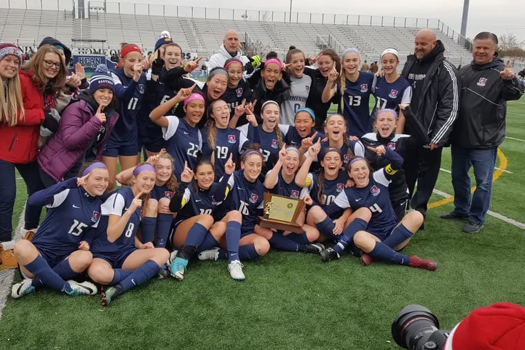 Eastern's girls celebrate the school's first state soccer title since 2006.