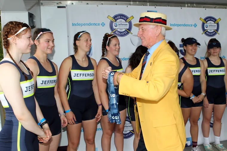 The Jefferson women’s varsity eight receive their silver medals from Ken Shaw after coming in second place for the Backe Trophy at the Dad Vail Regatta on Saturday.