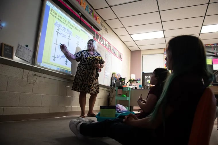 Emma Lambert teaches her fourth grade students math at Hamilton Elementary School in Sciota, Pa., on Thursday, September 15, 2022. Lambert had to take the math and reading portions of the basic skills requirement multiple times before she passed. Now she's in her fourth year of teaching.