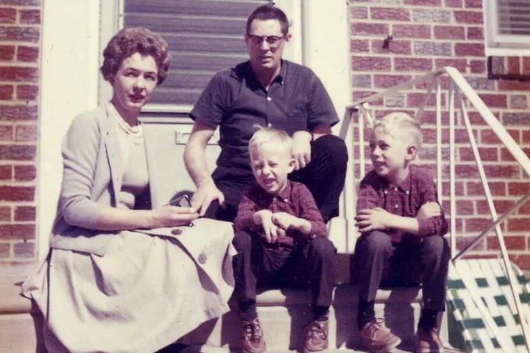 Mrs. Burlingame, husband John, and sons Michael and Gary sit on the stoop of their first home in Philly, on Benner Street in the Mayfair section.