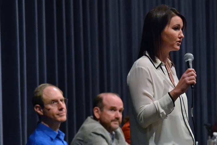 Congressional candidate Rachel Reddick, R, responds to a question as fellow Democratic congressional candidates Steve Bacher, L, and Scott Wallace look on during a meet-the-candidates forum in the race against the GOP’s U.S. Rep. Brian Fitzpatrick in Bucks County, at Council Rock North High School Tuesday February 27,2018. MARK C. PSORAS / For the Inquirer