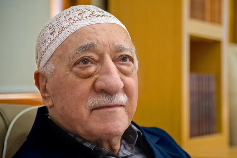 Turkish cleric Fethullah Gülen prays with followers last January at the 26-acre compound in the Pocono Mountains where he has lived in self-exiled isolation for 20 years.