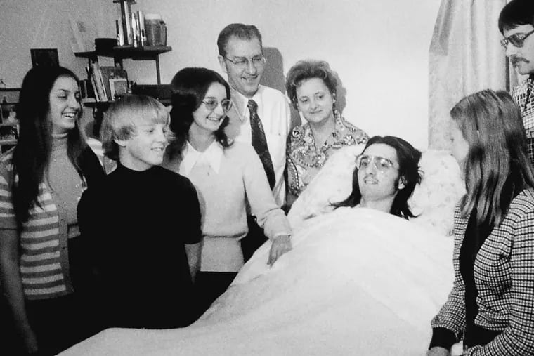 Buddy at home with his family, shortly after his accident.