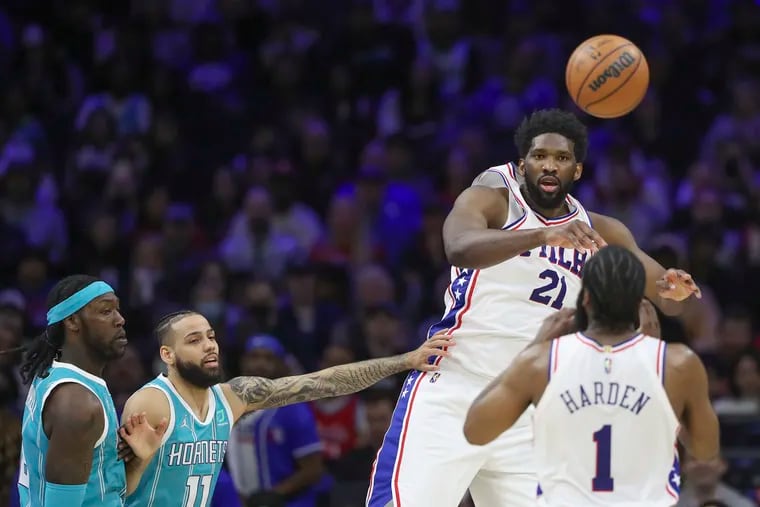 Sixers center Joel Embiid passes to James Harden in a game against the Hornets. Embiid's passing ability will be put to the test against the Raptors beginning Saturday.