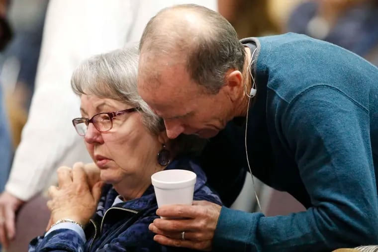DAVID ZALUBOWSKI / ASSOCIATED PRESS Scott Dontanville , co-pastor of the Hope Chapel, consoles a congregant before services yesterday in northeast Colorado to remember the shooting victims.