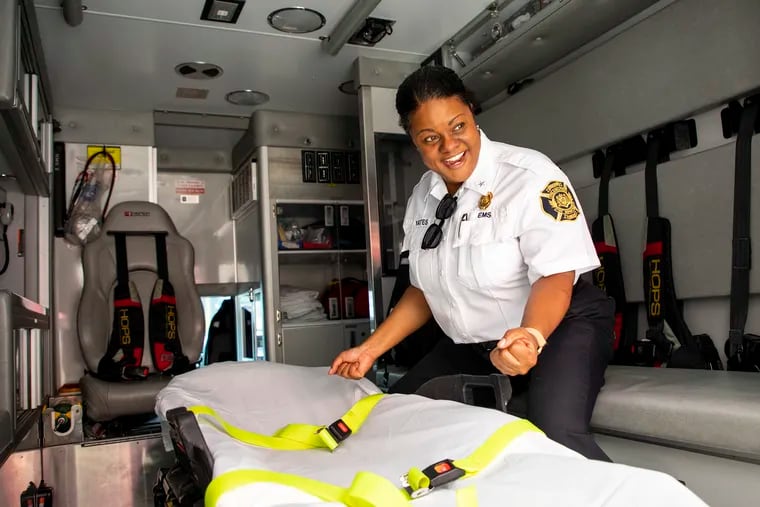 Crystal Yates, the Philadelphia Fire Department's assistant deputy commissioner for EMS, walks through a Medic 4 ambulance, reminiscing her time working as a paramedic.