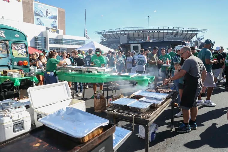 Exuberant fans tailgate outside of Lincoln Financial Field before the Eagles home opener against the San Francisco 49ers Sunday in a much-anticipated full return to the stadium since the pandemic began.