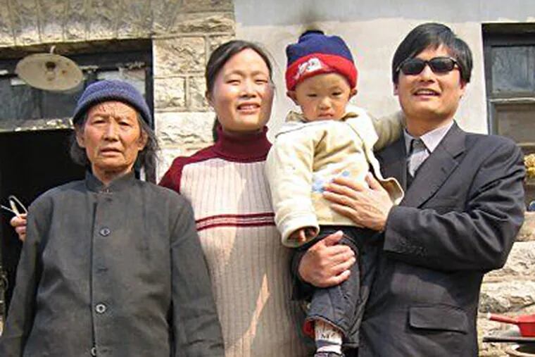 Rights lawyer Chen Guangcheng with his son, Chen Kerui; wife, Yuan Weijing; and mother in an undated photo. www.ChinaAid.org