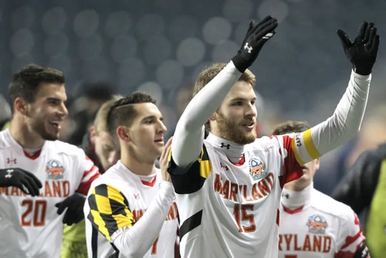Maryland's Patrick Mullins (2nd from the right) acknowledges the Maryland fans after Maryland defeated Virginia. (Charles Fox/Staff Photographer)
