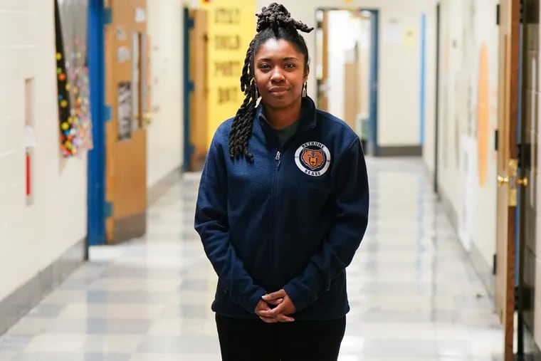 Fourth-grade teacher Takia McClendon at Bethune Elementary School in North Philadelphia. McClendon has to pick up retail shifts whenever she can to supplement her school district salary.