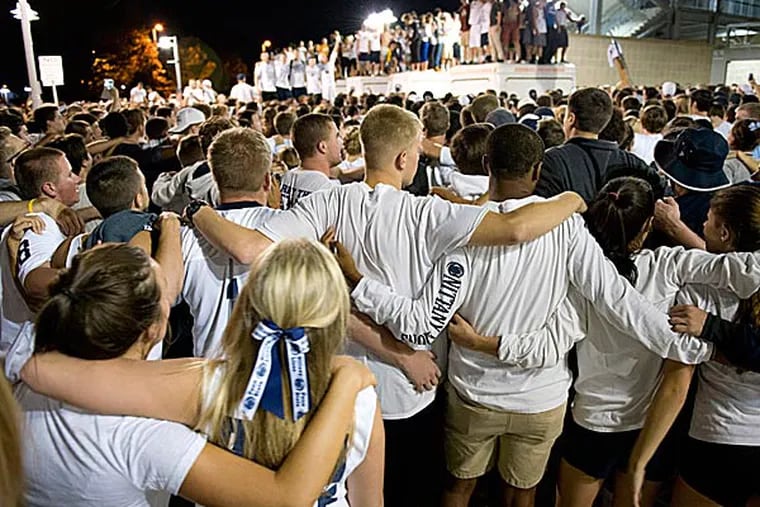Thousands of students sing the Penn State Alma Mater outside Beaver Stadium.. (John Beale/AP)