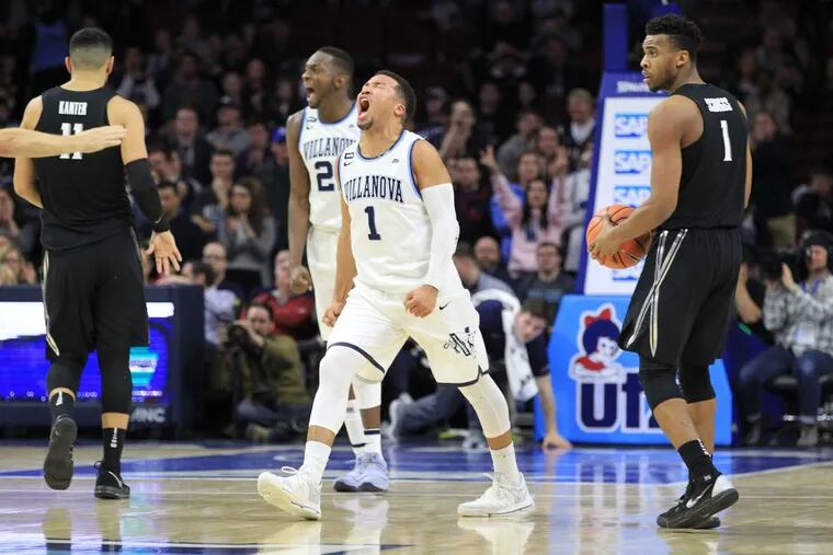 Dhamir Cosby-Roundtree, 2nd from left, and Jalen Brunson, 3rd from left, of Villanova celebrate as they extend their lead in the 2nd half against Xavier at the Wells Fargo Center on Jan 10, 2018. Villanova won 89-65.