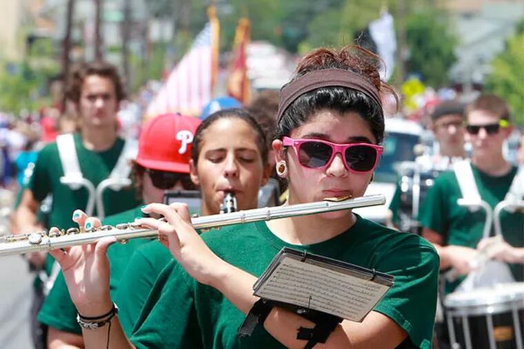 Spirit of '76: Members of the Audubon High School Marching Band performing during a July Fourth parade on Kings Highway in Mount Ephraim last year.