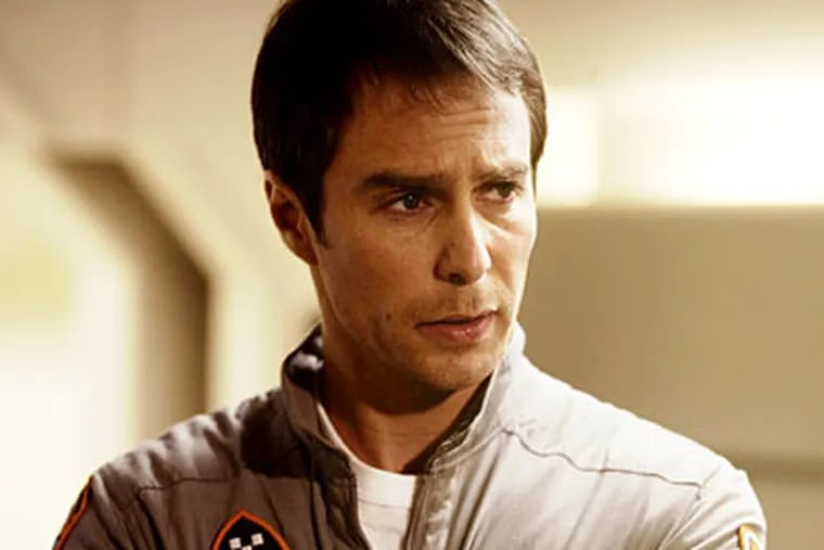 Sam Rockwell plays the sole crew member on a lunar base in “Moon”; with him is Gerty 3000 the robot, voiced by Kevin Spacey. The movie is a deceptively simple study of alienation, paranoia, and loneliness.