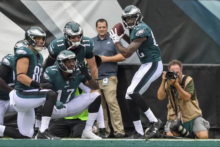 Eagles wide receiver Torrey Smith (right) starts a unique, baseball-themed end zone celebration with teammates (from left) Zach Ertz, Alshon Jeffrey and Carson Wentz after scoring on a 59-yard pass play in the first quarter.