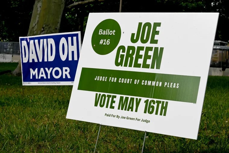 Joe Green and David Oh campaign signs in Center City. Who is responsible for cleaning up street signs after the election and a political campaign is over?