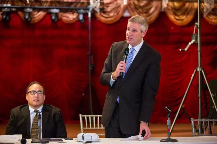 State Rep. Todd Stephens (R., Montgomery), right, speaks Monday, Feb. 12, 2018, during a Philly Neighborhood Small Business Council meeting at the Saigon Maxim restaurant in South Philadelphia about a state bill he introduced that would allow beer delis and other businesses to keep or erect interior bullet-resistant windows for workplace safety. Philadelphia City Councilman At-Large David Oh also spoke in favor of employers’ rights to install the protective windows.