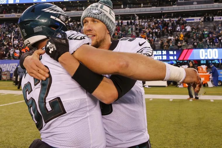 Eagles quarterback Nick Foles and center Jason Kelce embrace after the Eagles beat the New York Giants 34-29 on Sunday, December 17, 2017.