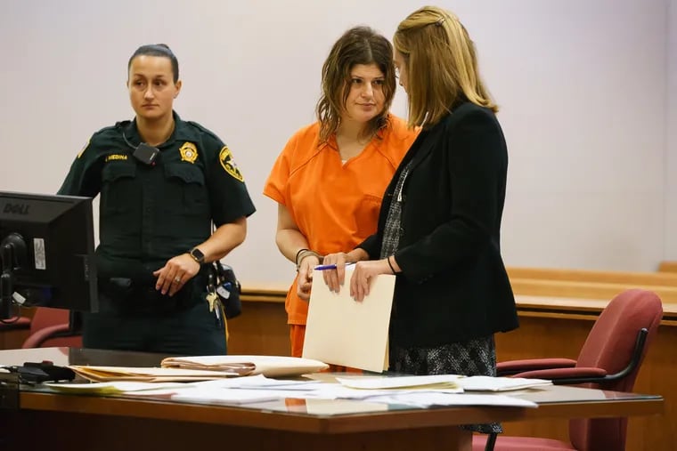 Heather Barbera appears at court for a hearing in Mays Landing, New Jersey, Public Defender Holly Bitters, right, Friday, August 3, 2018. Barbera faces murder charges for the beating deaths of her mother and grandmother in Ventnor.