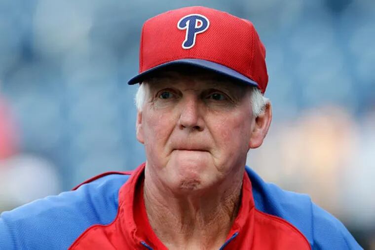 Charlie Manuel walks off the field before a baseball game against the Washington Nationals at Nationals Park Saturday, Aug. 10, 2013, in Washington. (Alex Brandon/AP)