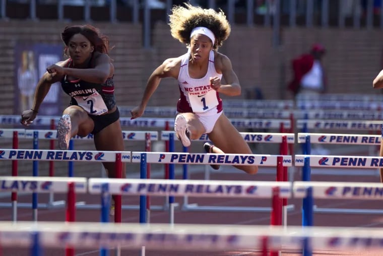 N.C. State’s Gabriele Cunningham, right, won the college women’s 100-meter hurdles championship at the Penn Relays on Saturday.