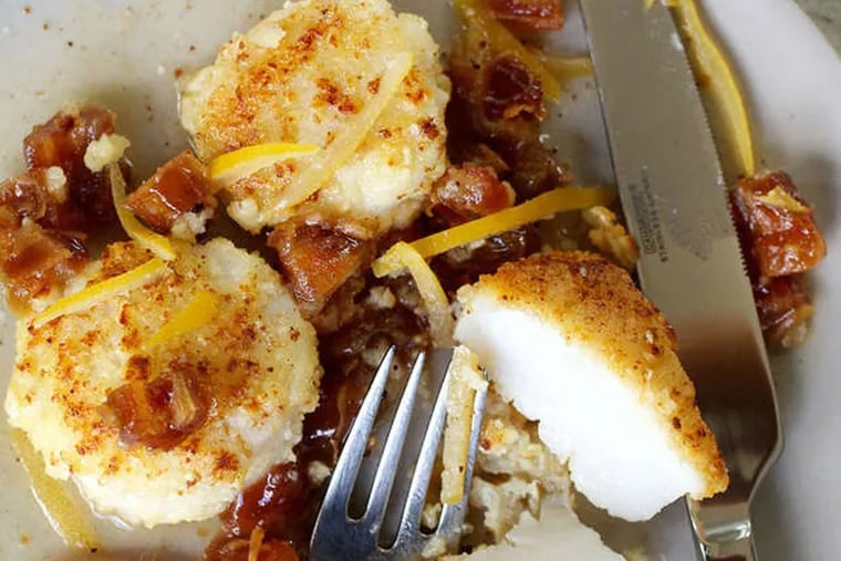 Almond-crusted scallops with dates and citrus. ( DEB LINDSEY / Washington Post )