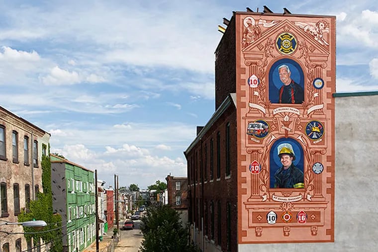 Jesse Gardner painted this East Kensington mural of of firefighters Robert Neary and Daniel Sweeney, killed in the 2012 Buck Hosiery warehouse fire. (Steve Weinik / FOR THE DAILY NEWS)