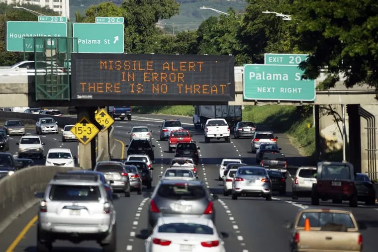 In this Jan. 13, 2018, file photo provided by Civil Beat, cars drive past a highway sign that says &quot;MISSILE ALERT ERROR THERE IS NO THREAT&quot; on the H-1 Freeway in Honolulu. The Hawaii state employee who mistakenly sent the alert warning of a ballistic missile attack is refusing to cooperate with federal and state investigators, officials said Thursday, Jan. 25.