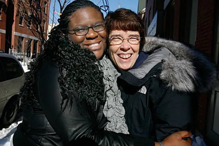 Tanisha Clanton, left, is shown with Sister May Scullion, right, of Project HOME. ( Charles Fox / Staff Photographer )
