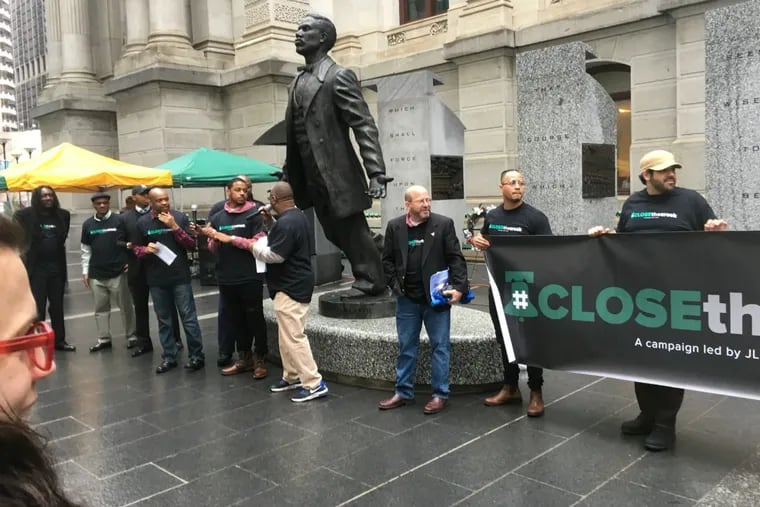 Prison reform activists protest outside Philadelphia City Hall April 25, 2018, calling for demolition of the House of Correction.