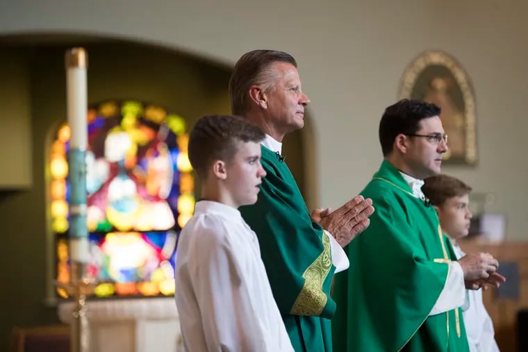 Steve Javie, 2nd from left, a Bucks County resident and longtime NBA referee, was recently ordained as one of seven permanent Catholic deacons in the Philadelphia Archdiocese. He delivered a sermon at the 5 p.m. mass at St. Andrews Catholic Church in Newtown on Aug. 17, 2019. The Rev. Marc Capizzi is 3rd from left.