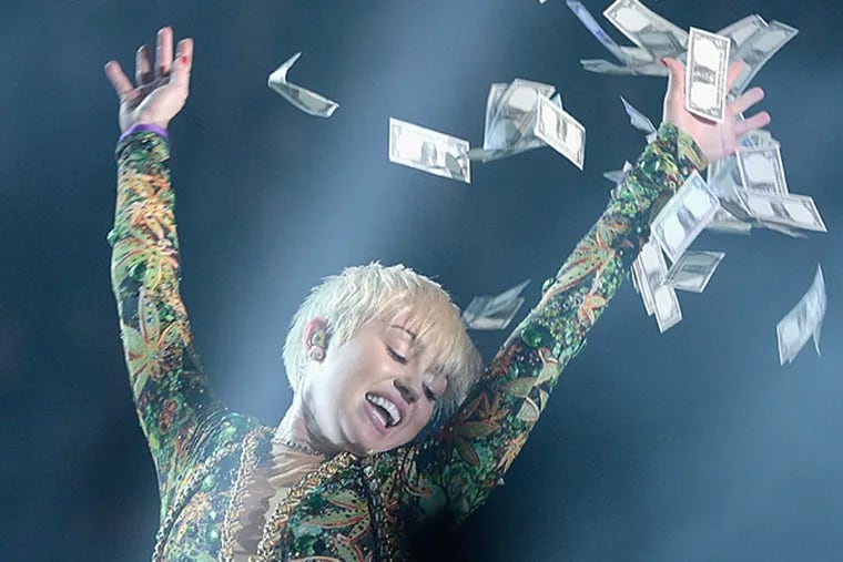 Miley Cyrus performs at the Barclays Center on April 5, 2014 in the Brooklyn borough New York City.  (Photo by Jamie McCarthy/Getty Images)