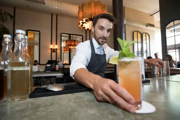 Nick Moreno serves up his creation, the Rhuby Mule. "Dry July" is under way and bars are creating various mocktails for those going alcohol-free this month. At Fork, the Rhuby Mule, made with rhubarb syrup, ginger beer, mint, and lime.