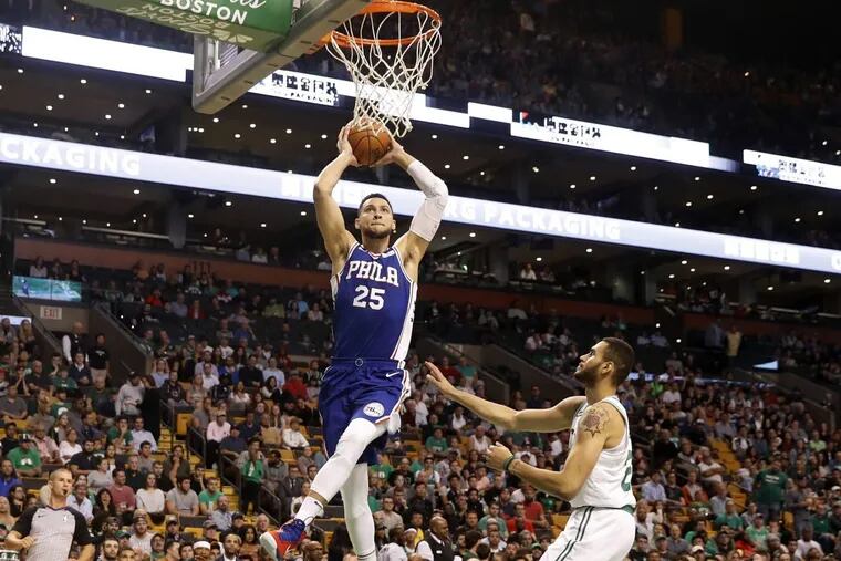 The 76ers' Ben Simmons goes in for a dunk past the Celtics' Abdel Nader during a preseason game Oct. 9.