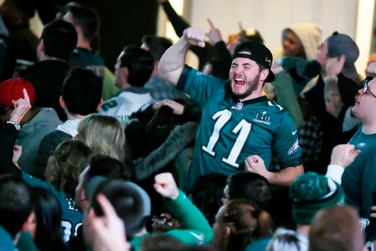 Adam Naugle of Mantua, N.J., cheers the Eagles' first touchdown against the Washington Redskins at Xfinity Live!  on Dec. 30, 2018.