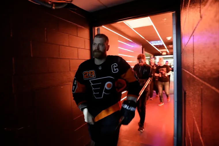 Flyers center Claude Giroux walks to the ice for pregame warm-ups before the Flyers play the Nashville Predators on Thursday, March 17, 2022 in Philadelphia.
