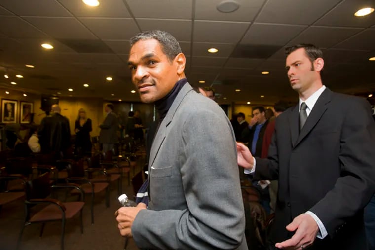 Ex-Sixers coach Maurice Cheeks leaves media conference at the Wachovia Center.
