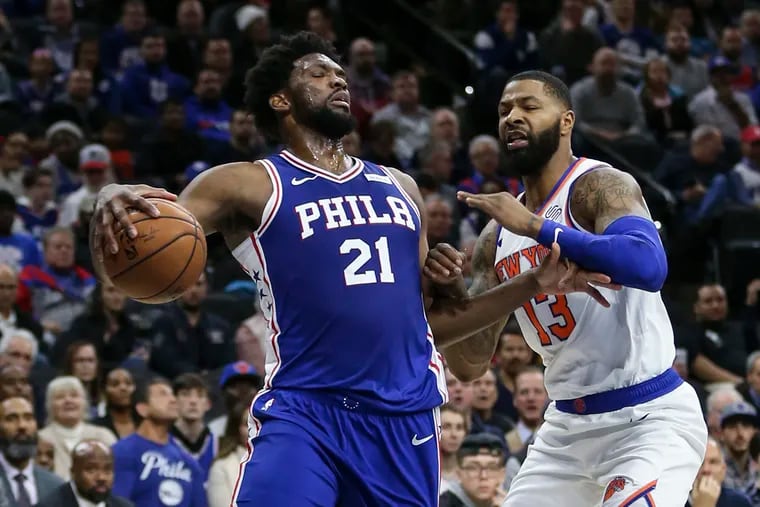 Sixers' Joel Embiid drives on the Knicks' Marcus Morris during the second quarter.