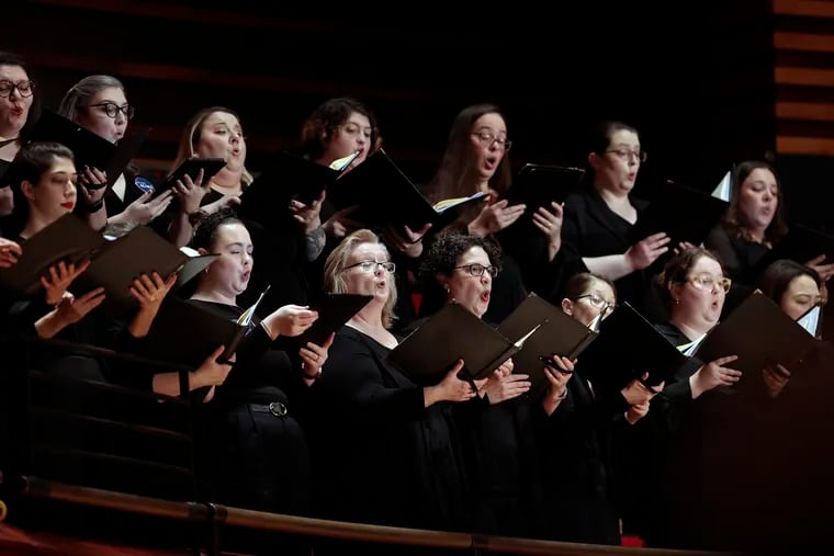 Members of the Philadelphia Symphonic Choir perform with the Philadelphia Orchestra at the Kimmel Center’s Verizon Hall Friday.