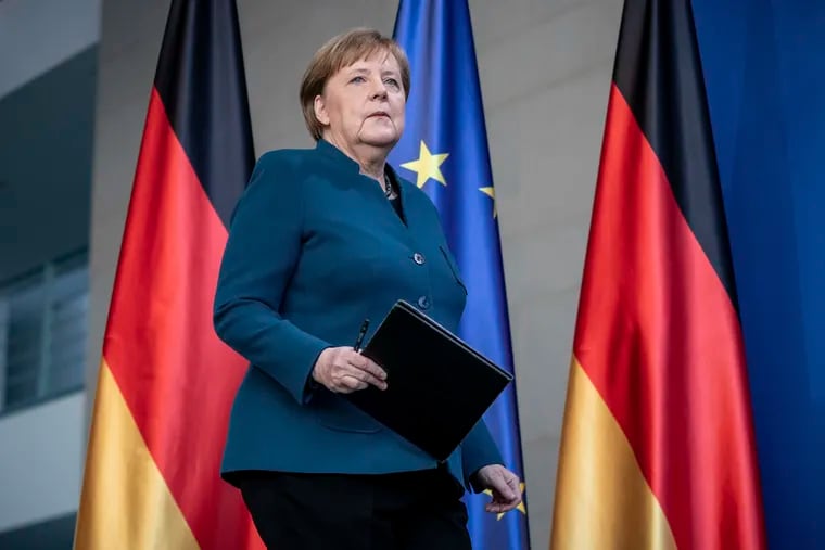German Chancellor Angela Merkel arrives for a press conference about the coronavirus, in Berlin, Sunday, March 22, 2020. German authorities have issued a ban on more than two people meeting outside of their homes, which they believe will be easier to follow than locking people in their homes. The vast majority of people recover from the new coronavirus. According to the World Health Organization, most people recover in about two to six weeks, depending on the severity of the illness. (Michael Kappeler/Pool photo via AP)