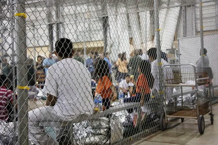 FILE - In this June 17, 2018, file photo, provided by U.S. Customs and Border Protection, people who have been taken into custody related to cases of illegal entry into the United States, sit in one of the cages at a facility in McAllen, Texas. Advocates were shocked to find an underage mom and her tiny, premature newborn daughter huddled in a Border Patrol facility this week in what they say was another example of the poor treatment immigrant families receive after crossing the border. The mother is a Guatemalan teen who crossed the border without a parent and was held at a facility in McAllen, Texas.
