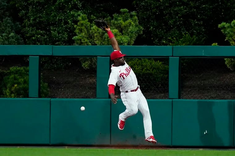 Phillies center fielder Odubel Herrera cannot catch a two-run double by Washington's Luis Garcia during the seventh inning of a loss Wednesday night.