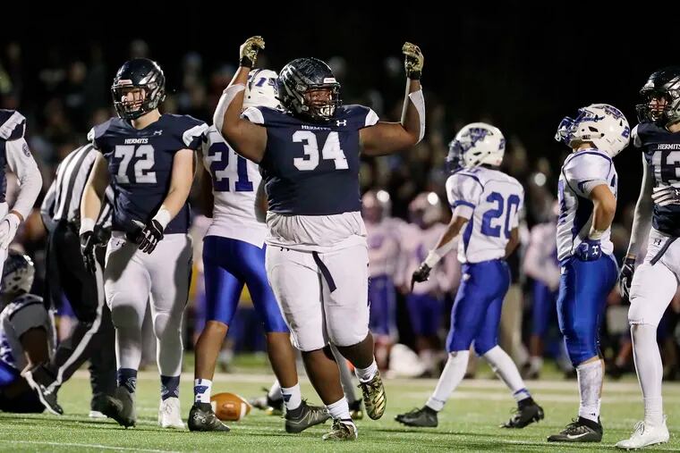 St. Augustine’s Isaiah Raikes (34) does a dance in the second half.