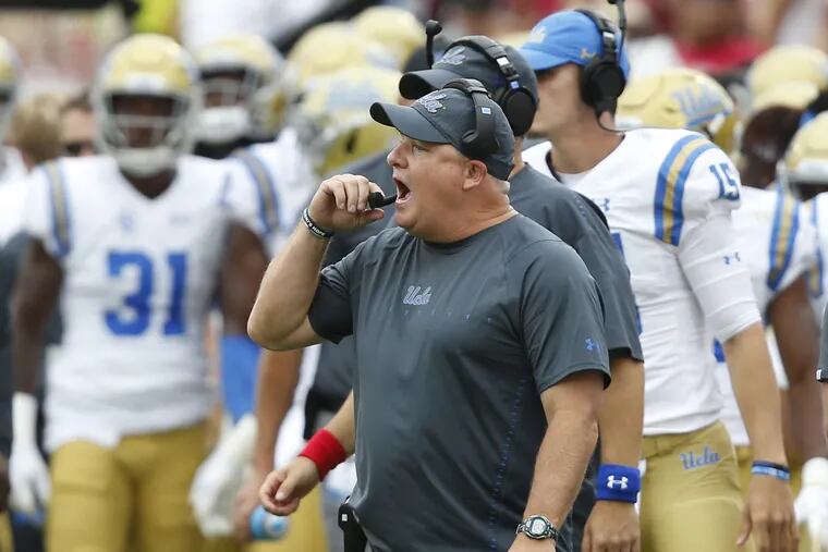 UCLA head coach Chip Kelly shouts on the sidelines in the second quarter of an NCAA college football game against Oklahoma in Norman, Okla., Saturday, Sept. 8, 2018. (AP Photo/Sue Ogrocki)
