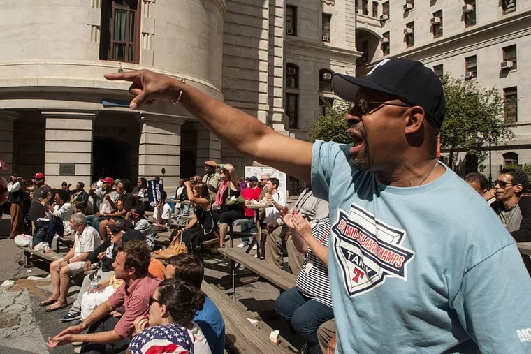 After taking part in a pep rally for the Taney Little League baseball team, Philadelphia mayor Michael Nutter joined the crowd in City Hall's courtyard stands to watch the game on large-screen televisions. August 15, 2014, Philadelphia, Pennsylvania. ( MATTHEW HALL / Staff Photographer )