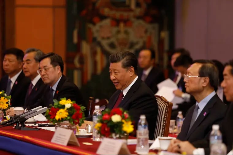 Chinese President Xi Jinping, center attends a bilateral meeting in Kathmandu, Nepal, Sunday, Oct. 13, 2019. Xi on Saturday became the first Chinese president in more than two decades to visit Nepal, where he's expected to sign agreements on some infrastructure projects. (Bikash Dware/The Rising Nepal via AP)