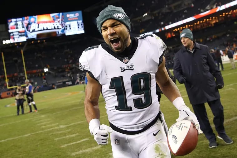 Golden Tate celebrates as he runs off the field following the Eagles' win on Sunday.