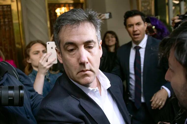 FILE - In this May 6, 2019, file photo, Michael Cohen, former attorney to President Donald Trump, leaves his apartment building before beginning his prison term in New York.